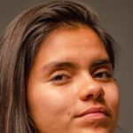 a close up of a person with a cell phone