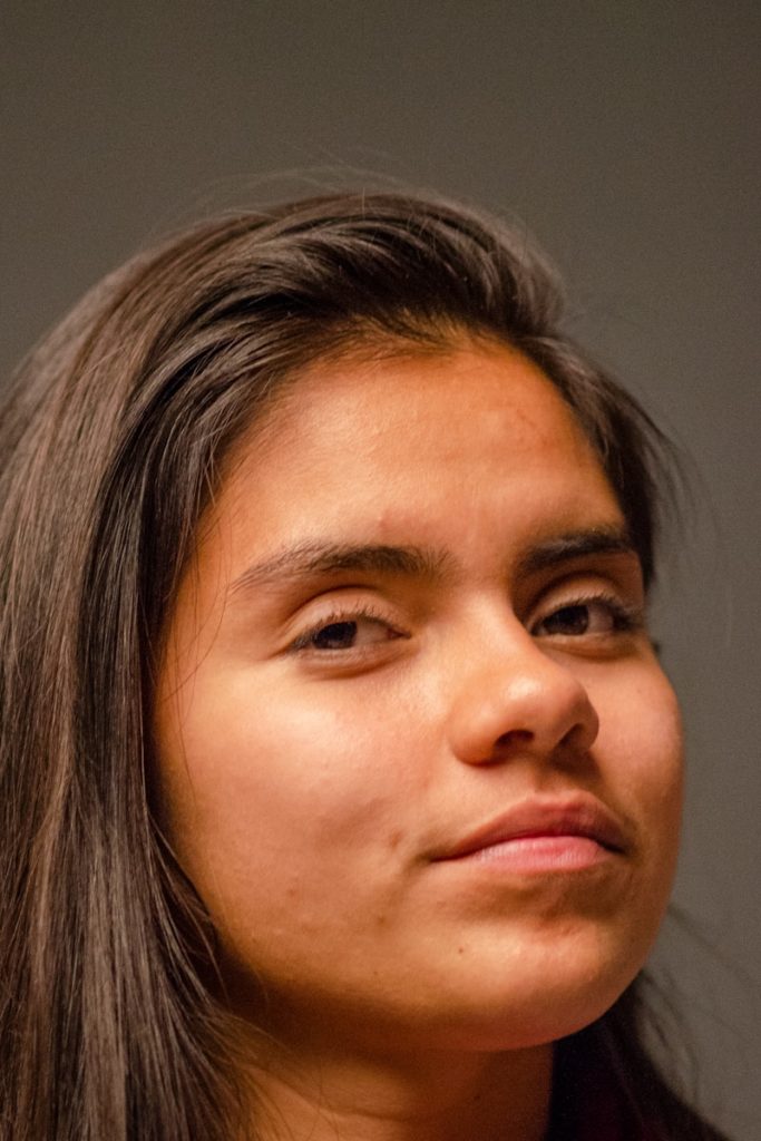 a close up of a person with a cell phone