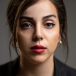 woman with red lipstick and black mascara